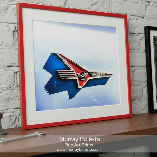 a red and white Thunderbird emblem against a blue background. Classic Ford Thunderbird Car Art Print - Vintage Automotive by Murray Bolesta
