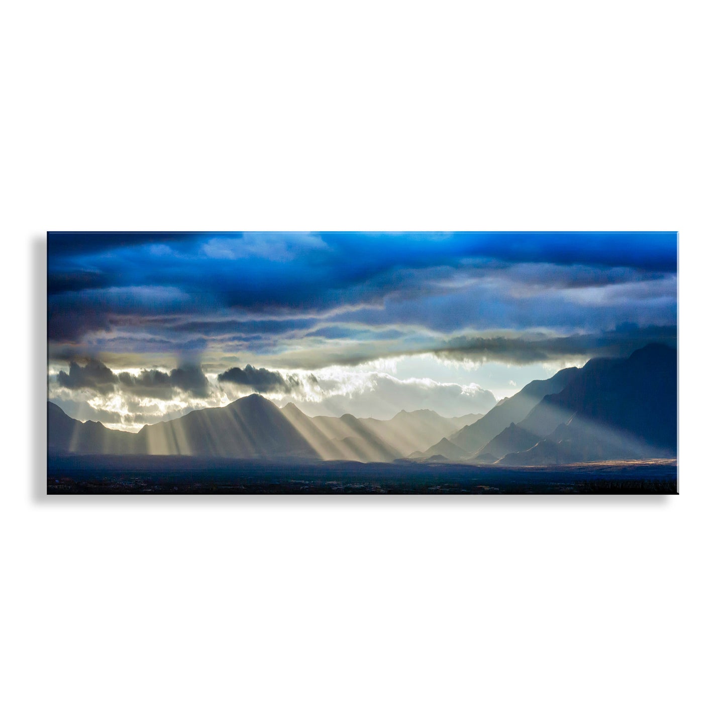 Panoramic view of mountains with sunlight piercing through clouds. Desert Storm Sky Art with Mountain Sunburst in Southern Arizona Monsoon