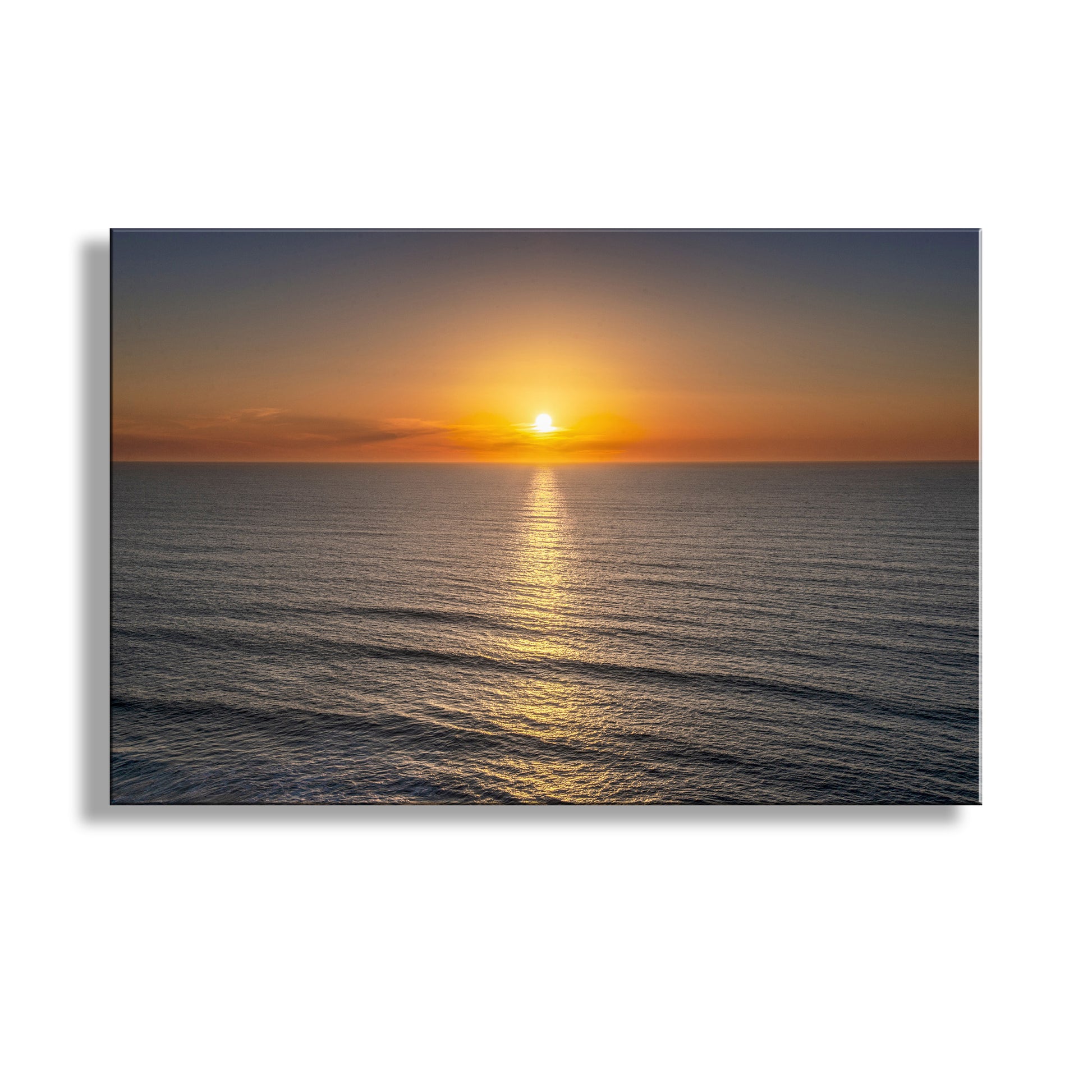 Sunset over the ocean with a clear sky. My radiant California North Coast ocean sunset print for your walls. Here, a placid Pacific Ocean radiates its brilliance on the California coast! I captured this splendid scene near Crescent City. Original, unique signed art by Murray Bolesta.