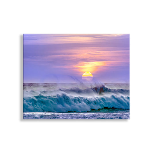 Sunset over the ocean with waves crashing against the shore. Santa Barbara Coast California Photo with Pacific Ocean Sunset