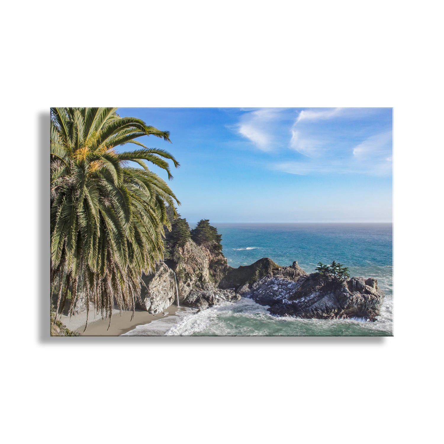 Coastal scene with palm trees, rocky cliffs, and ocean under a blue sky. Beautiful McWay Falls! My splendid California beach photography for your walls: this is the Big Sur coast with a magnificent palm tree to boot!; Original, unique art for your walls by Murray Bolesta.
