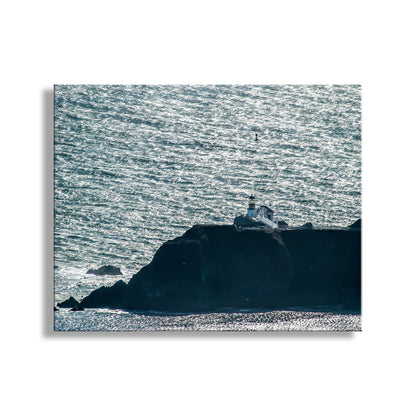 Lighthouse on a rocky island with choppy ocean waters. Guarding the entrance to San Francisco Bay, Point Bonita Lighthouse stands on its own! This is Marin Headlands, in the Golden Gate National Recreation Area of northern California. Original, unique signed art by Murray Bolesta!