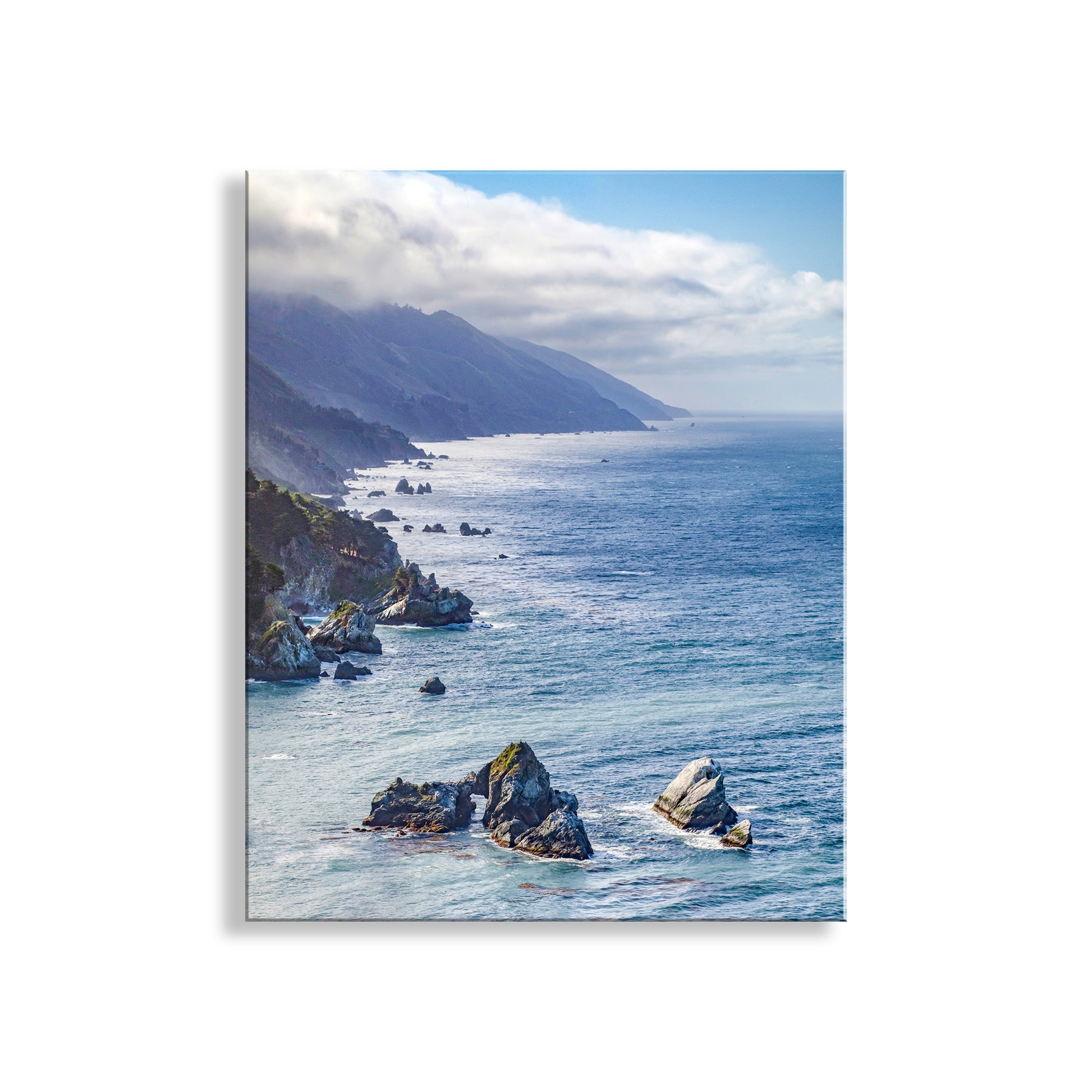 Scenic view of a coastal landscape with rocky outcrops and mountains. Pacific Coast Framed Art Print for Home at Big Sur California