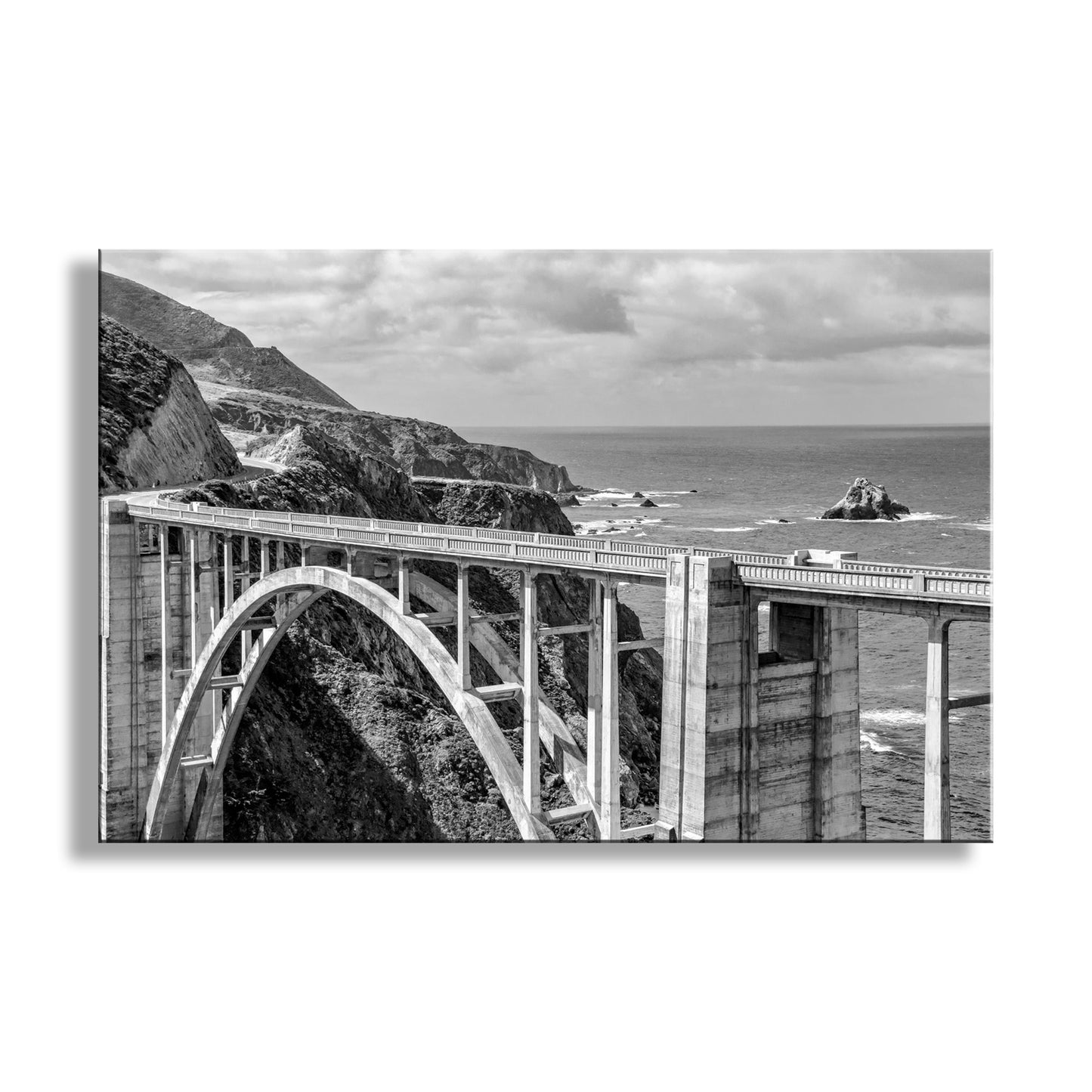 Black and white photograph of a coastal bridge with ocean and cliffs. Beautiful Big Sur in black &amp; white! It looks a bit lonely, but it's not: this is a very popular stretch of California coast, and was protected in 1976 for all humankind forever. Original, unique, signed art by Murray Bolesta!