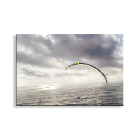 Parasail over a body of water with a cloudy sky. Paraglider Art Print at Torrey Pines San Diego California