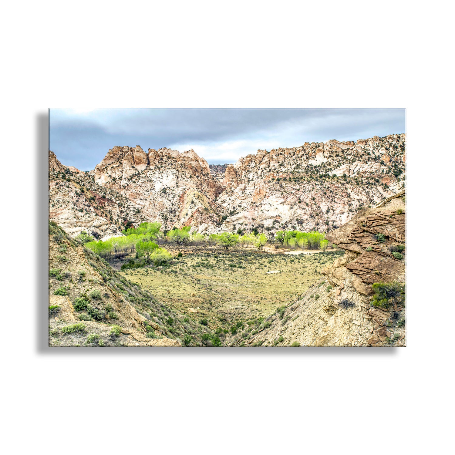 Scenic view of a mountainous landscape with rocky cliffs and greenery.