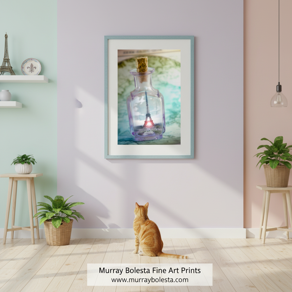 A small glass bottle with a cork stopper containing a miniature Eiffel Tower inside, set against a blurred green and blue background. Paris France Wall Art | Eiffel Tower Fantasy Painterly Art Gift for Francophiles by Murray Bolesta!