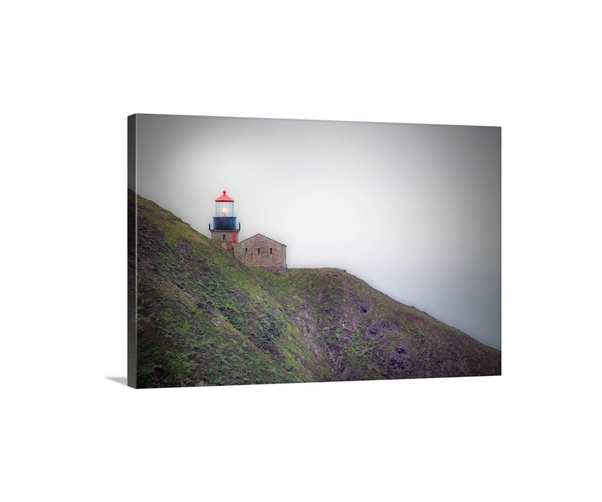 Lighthouse on a hill with a foggy background. My dramatic Point Sur Lighthouse art print for your walls: the stark landscape of the Big Sur seashore of California, planet Earth! Original, unique signed art by Murray Bolesta.