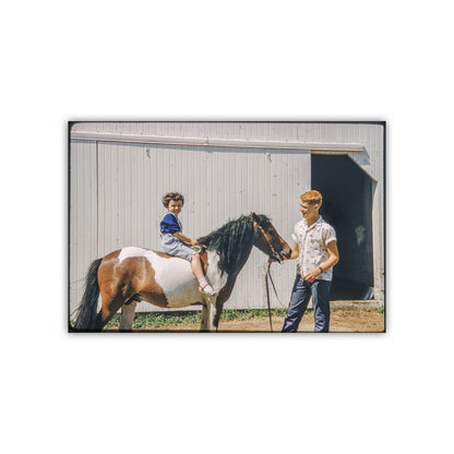 Two children with a pony in front of a barn. Vintage Farm Picture with Horse Pony and Barn in Iowa as Mid Century Wall Art from American Heartland