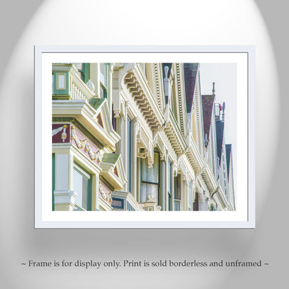 Framed print of architectural details with a white frame on a gray background. My unique San Francisco art print to beautify your walls: the "Painted Ladies" vintage homes on Alamo Square Park! Original, unique signed art by Murray Bolesta.