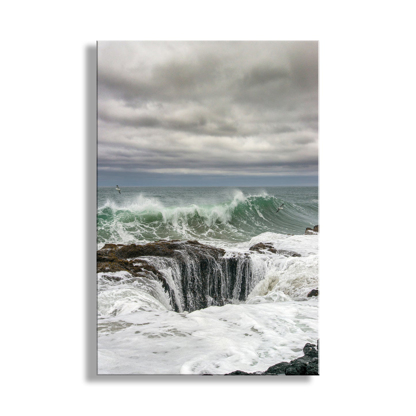 Ocean waves crashing against a rocky shore with a cloudy sky.  Beautiful Oregon coast! My terrific Thor's Well art print for your viewing pleasure. Is this the drainpipe of the Pacific Ocean? Not exactly, but this seemingly bottomless sinkhole on the coast of Oregon USA is a fascinating rock formation. Warning: don't get too close! Original, unique signed art by Murray Bolesta.