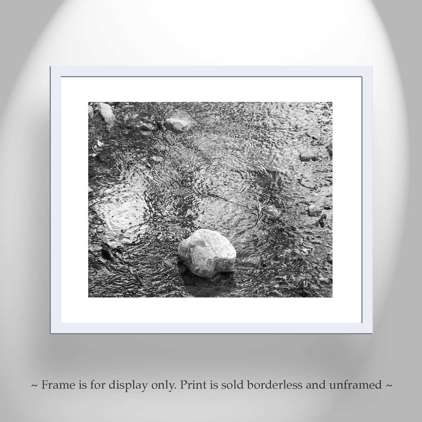 Framed black and white print of a stone in water on a gray background. Madera Canyon AZ Mountain Creek Fine Art Water Photograph in B&W