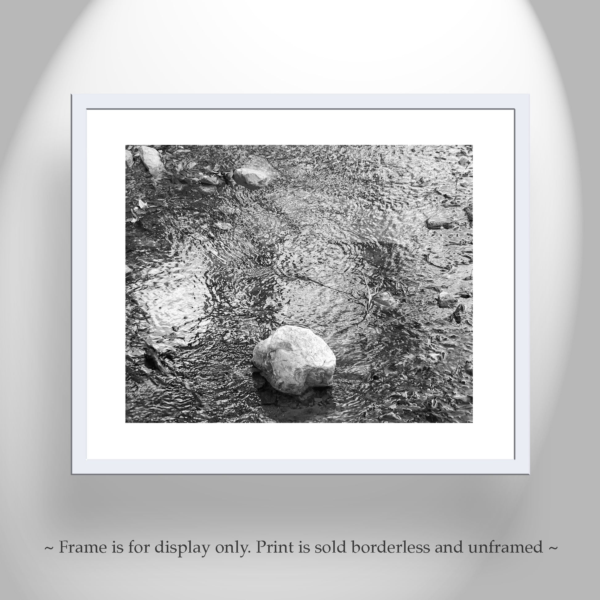 Framed black and white print of a stone in water on a gray background. Madera Canyon AZ Mountain Creek Fine Art Water Photograph in B&W