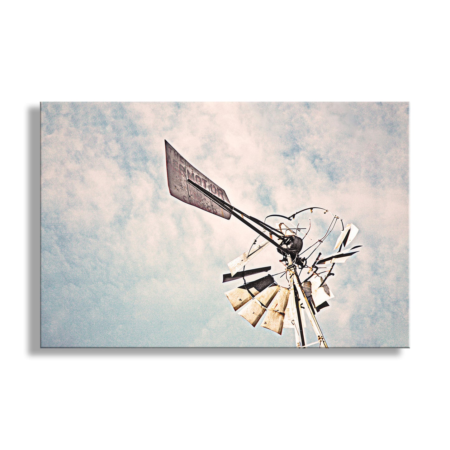 Decorative windmill against a cloudy sky background. Vintage Windmill Wall Art Print in Rustic Style in Southern Arizona USA!