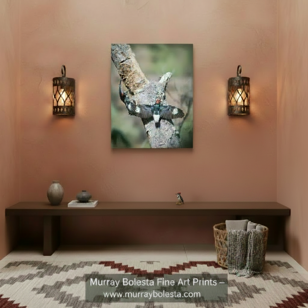 A pair of black and white birds with red markings on their heads are perched on a tree branch, with one bird in flight and the other sitting on the branch. Forest Bird Wall Art with Woodpeckers as Home Nature Decor by Murray Bolesta