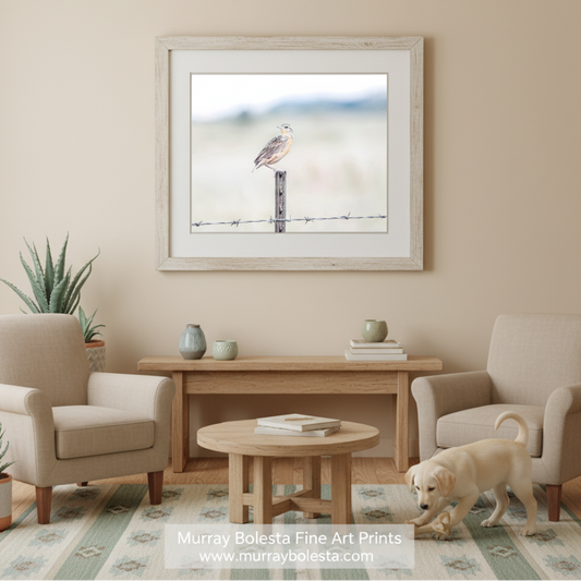 A small bird perches on a wooden post, facing to the right, with a blurred background suggesting a natural setting. Bobolink Bird Art | Minimalist Wildlife Photography Print by Murray Bolesta