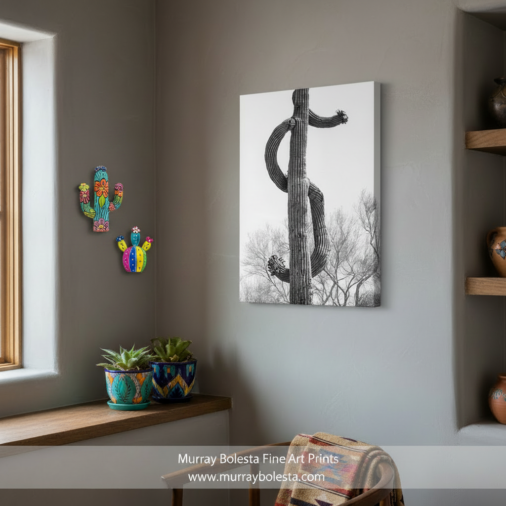 A black & white photograph of a twisted, gnarled cactus pole reaching upwards against a clear sky. Desert Saguaro Cactus Dollar Sign | Black & White Wall Art by Murray Bolesta