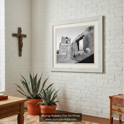 A black and white photograph of a dilapidated building with a large window, set against a clear sky. Old Desert Adobe Arizona Church Art - Black & White Print by Murray Bolesta
