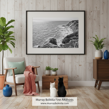 A black and white photograph depicting a rocky coastline with crashing waves, overlooking the ocean. Block Island Mohegan Bluffs - Rhode Island Black & White Coastal Art by Murray Bolesta!