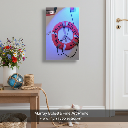 A red life preserver with the word "BLOCK ISLAND" written on it, hanging on a wall. Nautical Wall Art | Block Island Ferry Lifesaver Print by Murray Bolesta!