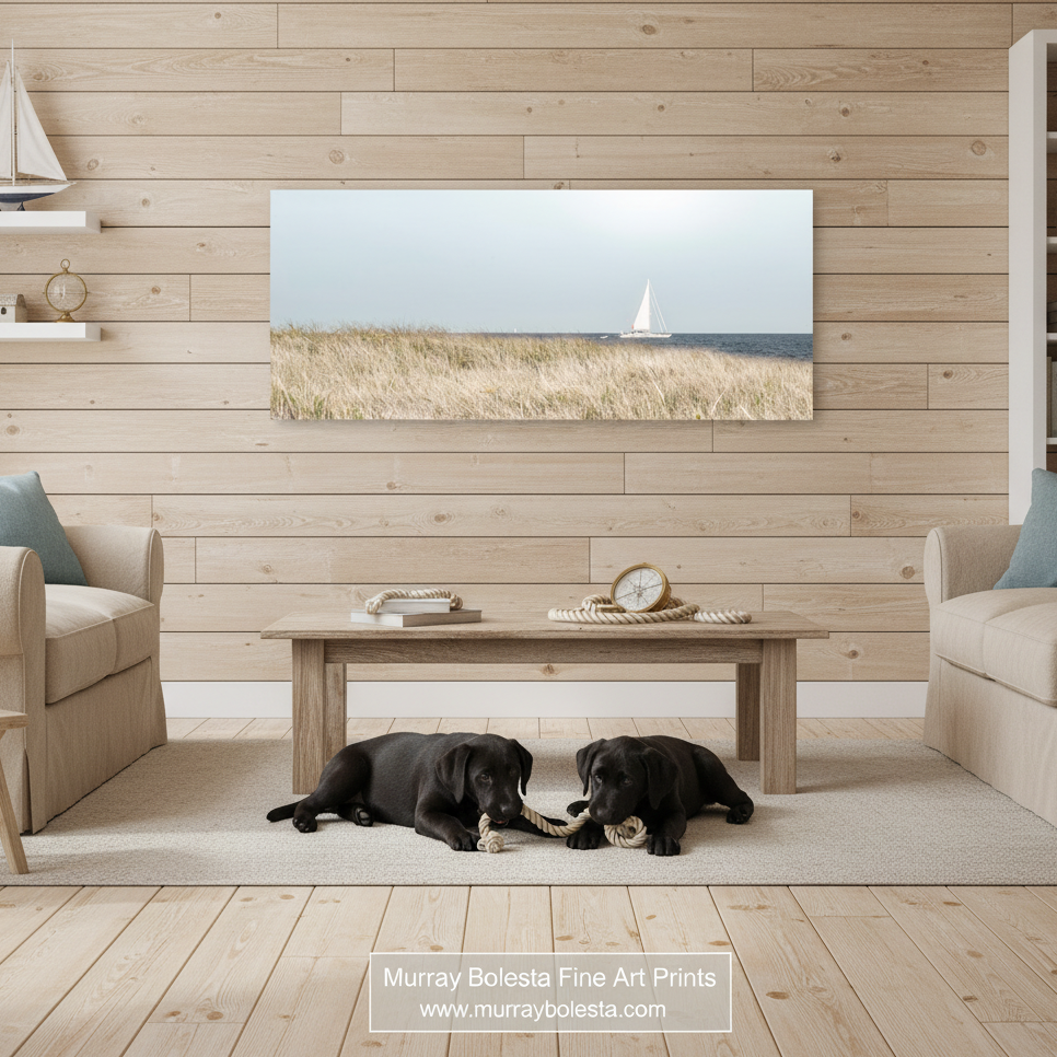 A white sailboat is sailing on the water, with a grassy field in the foreground and a clear sky above. Block Island Sailing Panorama - Rhode Island Beach Grass Coastal Print by Murray Bolesta!