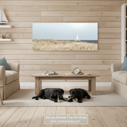 A white sailboat is sailing on the water, with a grassy field in the foreground and a clear sky above. Block Island Sailing Panorama - Rhode Island Beach Grass Coastal Print by Murray Bolesta!