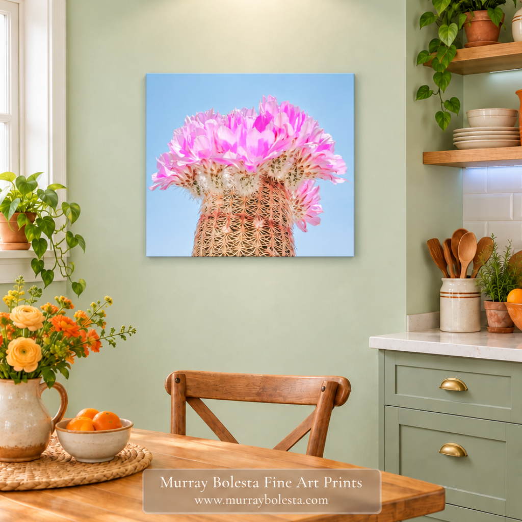 Pale green kitchen mockup with smaller cactus blossom artwork and cool under-shelf lighting. Cactus flower art by Murray Bolesta.