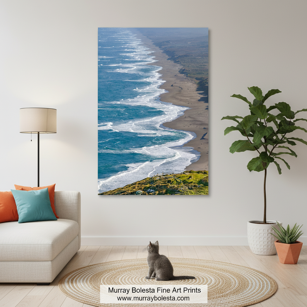 a serene coastal scene with a long, sandy beach stretching out towards the deep blue ocean. The waves are gently lapping against the shore, creating a rhythmic pattern that adds a sense of tranquility to the scene. The image is a captivating view of nature's beauty, showcasing the harmonious coexistence of the land and the sea. Point Reyes Vertical Beach Art | Marin County California Print by Murray Bolesta