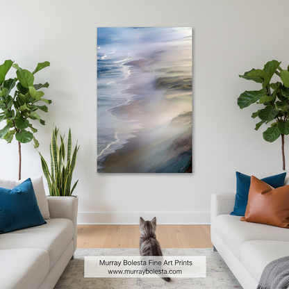 A vertical abstract canvas print of a beach shoreline with soft waves, displayed on a white wall in a modern living room setting with a cat sitting below it. Point Reyes art by Murray Bolesta!