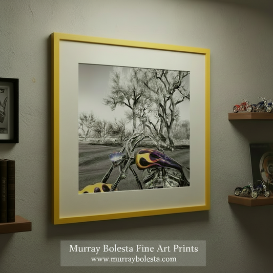 A black and white photograph of a motorcycle with colorful flames on the gas tank, set against a backdrop of bare trees and a fence. Motorcycle Art Print – Custom Show Bike in Black & White by Murray Bolesta