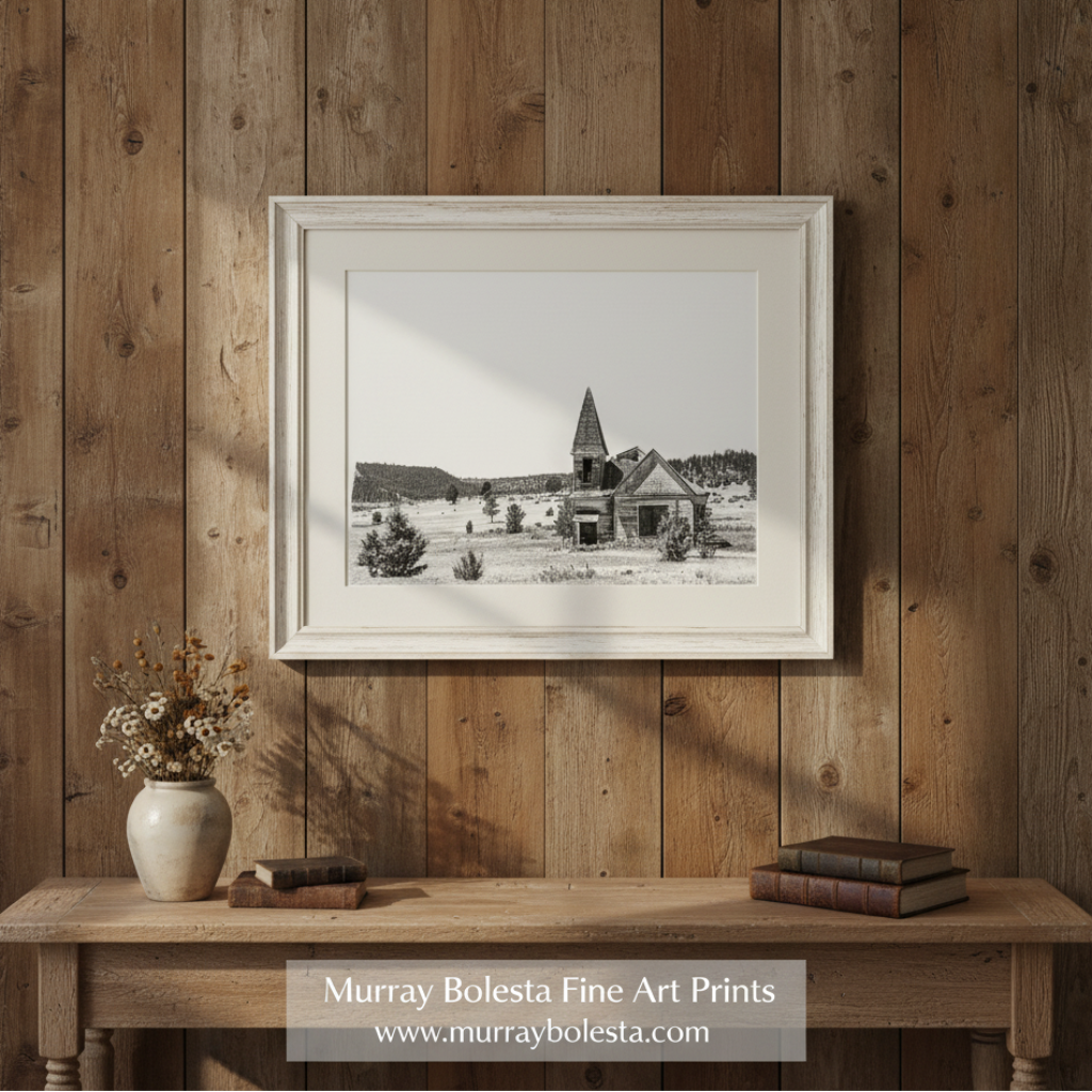 Black and white photograph of an abandoned church in a field with trees in the background. Surreal Black and White Old Western Church Photography Art Print by Murray Bolesta