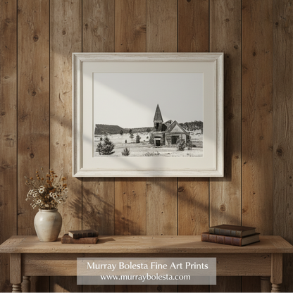 Black and white photograph of an abandoned church in a field with trees in the background. Surreal Black and White Old Western Church Photography Art Print by Murray Bolesta