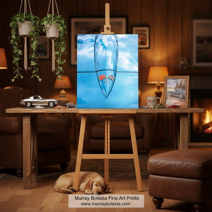 corvette car art. A square art print featuring a blue water droplet with a small red and white checkered flag, displayed on a wooden easel in a cozy, warm-toned living room. A small dog is sleeping on the floor below, and a watermark for 'Murray Bolesta Fine Art Prints' is visible at the bottom.