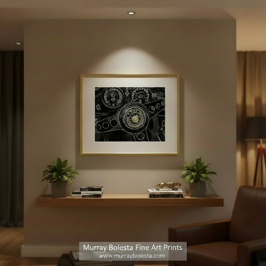 The image is a close-up of a car's steering wheel, featuring various gauges and controls. Jaguar E-Type Abstract Art Print | Vintage Sports Car Decor by Murray Bolesta