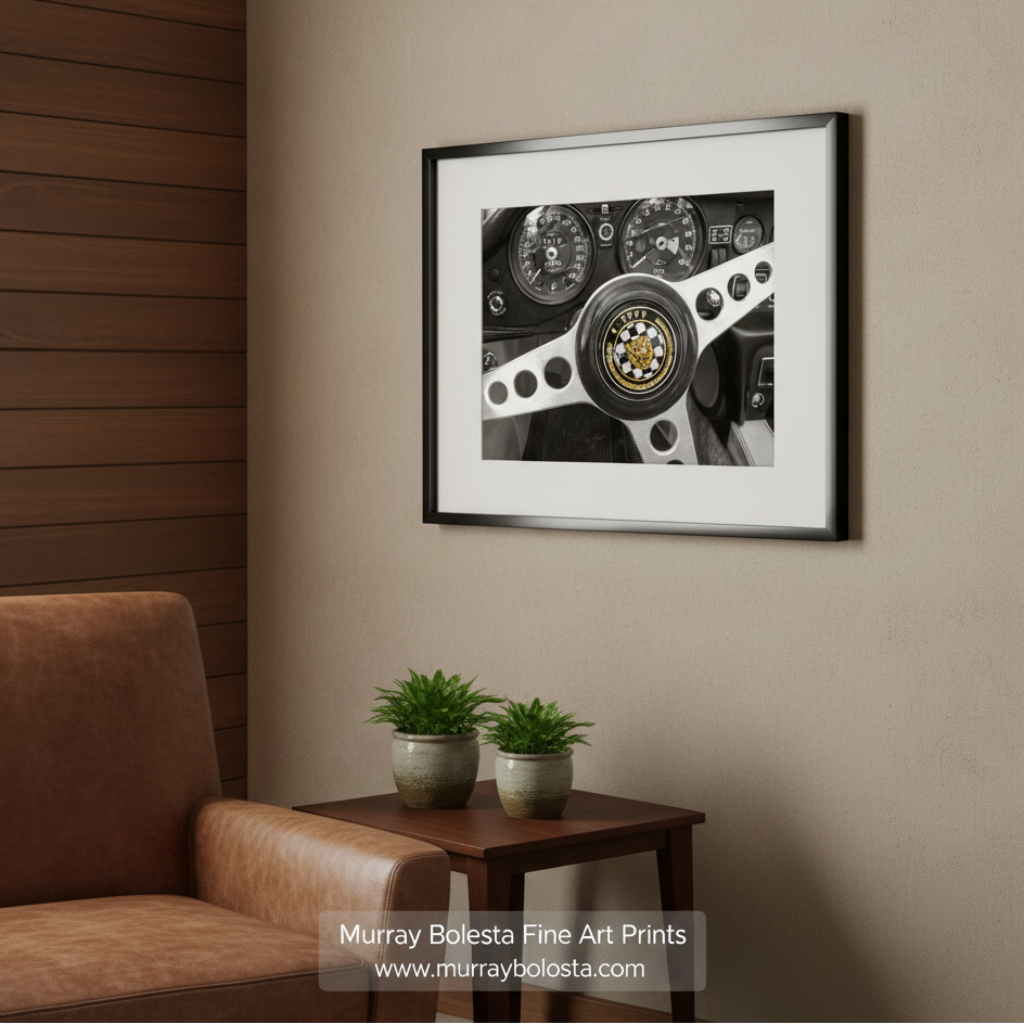 the steering wheel of a car, featuring the Jaguar E-Type logo prominently displayed. Jaguar E-Type Art Print | Classic British Sports Car Photo by Murray Bolesta
