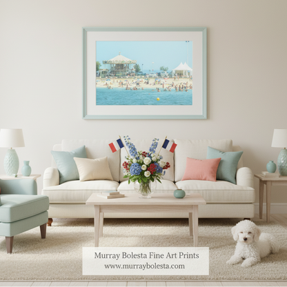 A lively beach scene with a carousel, umbrellas, and people enjoying the sunny day. France Beach Carousel Lacanau | Pastel Atlantic Ocean Wall Art by Murray Bolesta