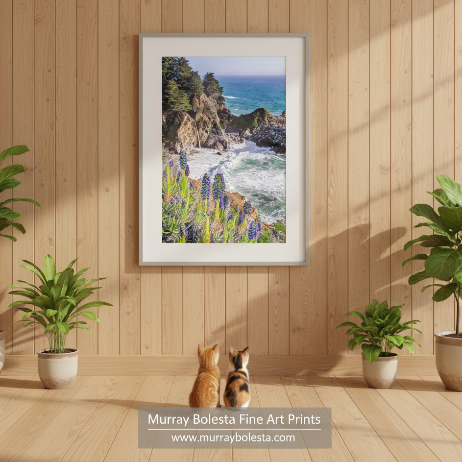 McWay Falls art by Murray Bolesta! A picturesque coastal scene with a rocky cliff overlooking the ocean, surrounded by lush vegetation and vibrant purple flowers. McWay Falls Big Sur Art Print Pacific Coast Highway California Decor