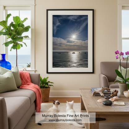 a serene ocean scene with a bright sun shining through the clouds, casting a warm glow on the water and the rocky shoreline. Oregon Coast Sunset Art | Port Orford Pacific Ocean Beach Print by Murray Bolesta!