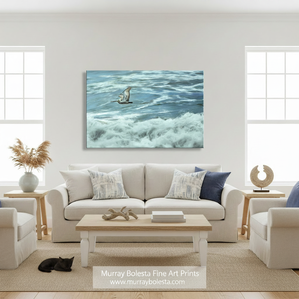 A seagull soars above the crashing waves of the ocean, its wings spread wide as it glides effortlessly above the foamy water. Flying Pelican Art | Pacific Ocean San Diego California Print by Murray Bolesta