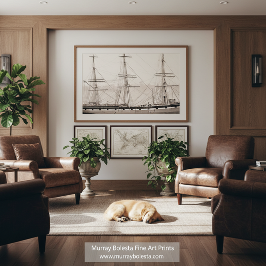 Balclutha San Francisco by Murray Bolesta! A large framed black and white nautical art print of a sailing ship hangs on a light wall in a beautifully styled room with wood paneling, brown leather armchairs, potted plants, and a golden dog sleeping on a rug. A watermark for 'Murray Bolesta Fine Art Prints' is visible at the bottom.