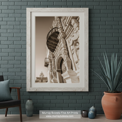 A sepia photograph of a historic building with intricate architectural details, including a balcony and ornate carvings. San Xavier del Bac Mission Art - Tucson Arizona Church Print by Murray Bolesta
