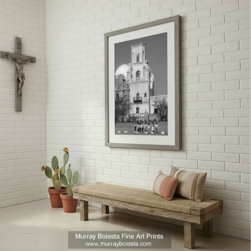 A group of children standing in front of a large, ornate building with a bell tower. San Xavier Mission Black & White Photo - Tucson Arizona Print by Murray Bolesta