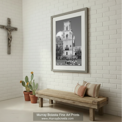 A group of children standing in front of a large, ornate building with a bell tower. San Xavier Mission Black & White Photo - Tucson Arizona Print by Murray Bolesta