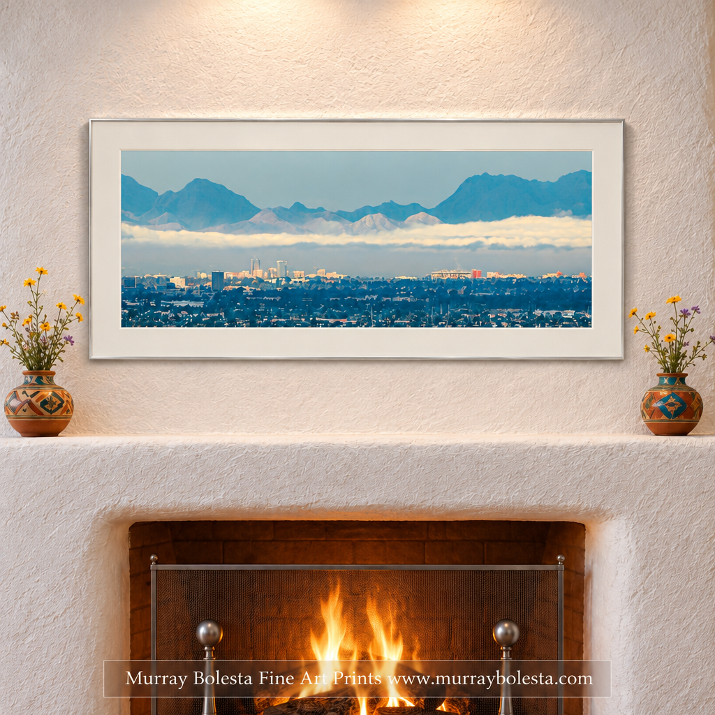 City of Tucson Arizona panoramic art with Tucson Mountains in background with winter clouds. Art by Murray Bolesta