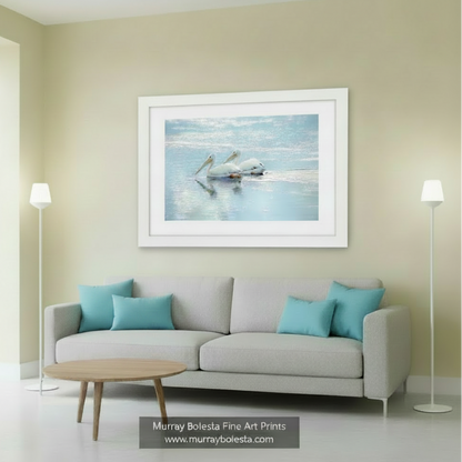 Two white pelicans with yellow beaks are resting on the water's surface, their reflections visible in the calm water. White Pelican Bird Art - Dreamy Wetlands Wildlife Decor Print by Murray Bolesta