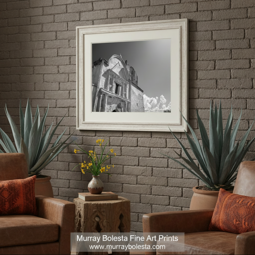 A black and white photograph of a historic building with a dome and arched windows, set against a cloudy sky. Spanish Colonial Mission Black & White Art - Southwest Print by Murray Bolesta